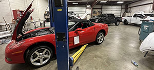 Corvette on the lift at Auto Body Specialties, Lafayette, Indiana
