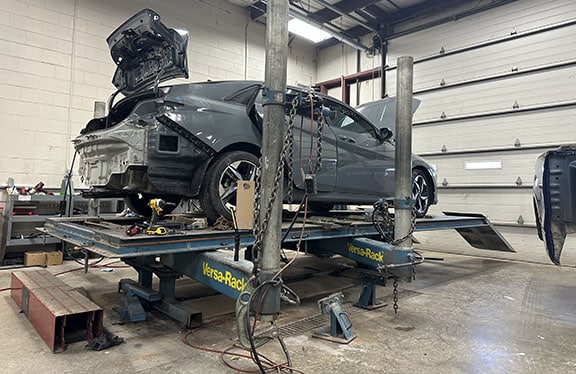 Vehicle on the rack at Auto Body Specialties in Lafayette, IN